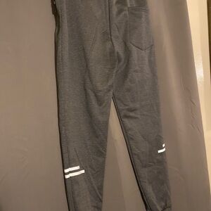 Charcoal grey solid knitted mid-rise track pants.